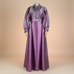 Metallic brocade boubou gown with dramatic bell sleeves, shown in sky blue, pink and purple