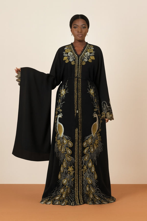 Black peacock embroidered boubou kaftan with matching shawl, worn by a model