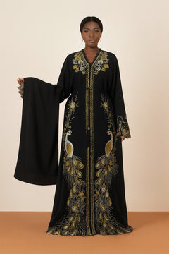 Black peacock embroidered boubou kaftan with matching shawl, worn by a model