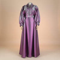 Metallic brocade boubou gown with dramatic bell sleeves, shown in sky blue, pink and purple