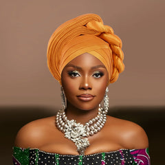 Woman wearing a raw silk pre-tied auto gele head wrap