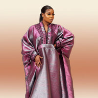 Metallic brocade boubou gown with dramatic bell sleeves, shown in sky blue, pink and purple