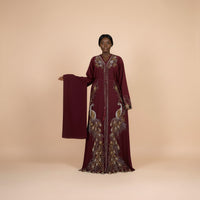 Wine peacock embroidered boubou kaftan with matching shawl, worn by a model