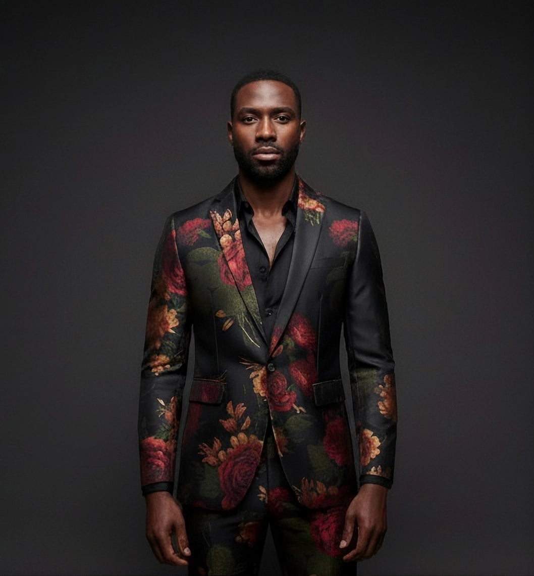 Man wearing a floral suit jacket against a dark background
